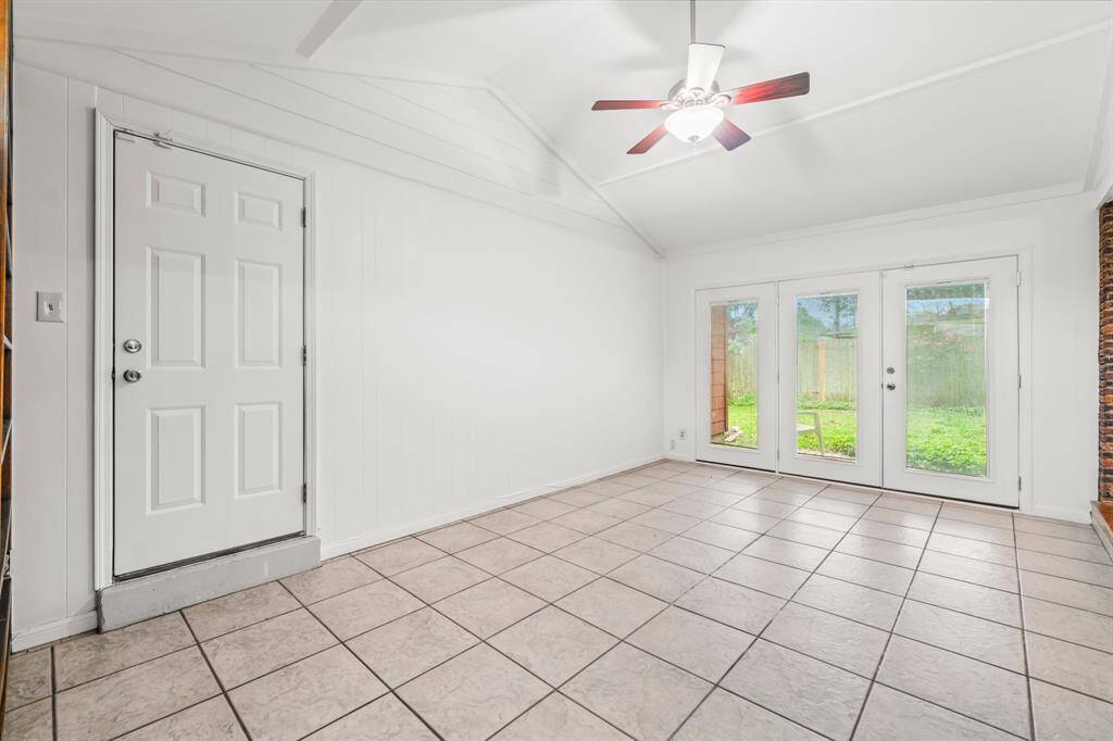 Flex Space with beautiful french doors (built-in blinds) leading to backyard. This space could be a home office, media room, craft room, game room, fitness room - endless possibilities!