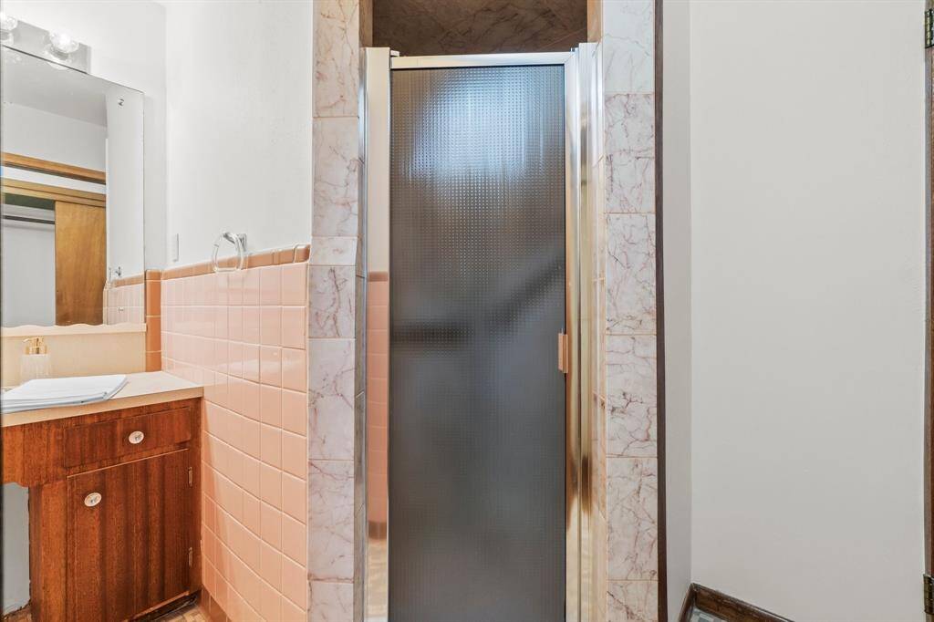Separate Shower area with primary bathroom to the left.