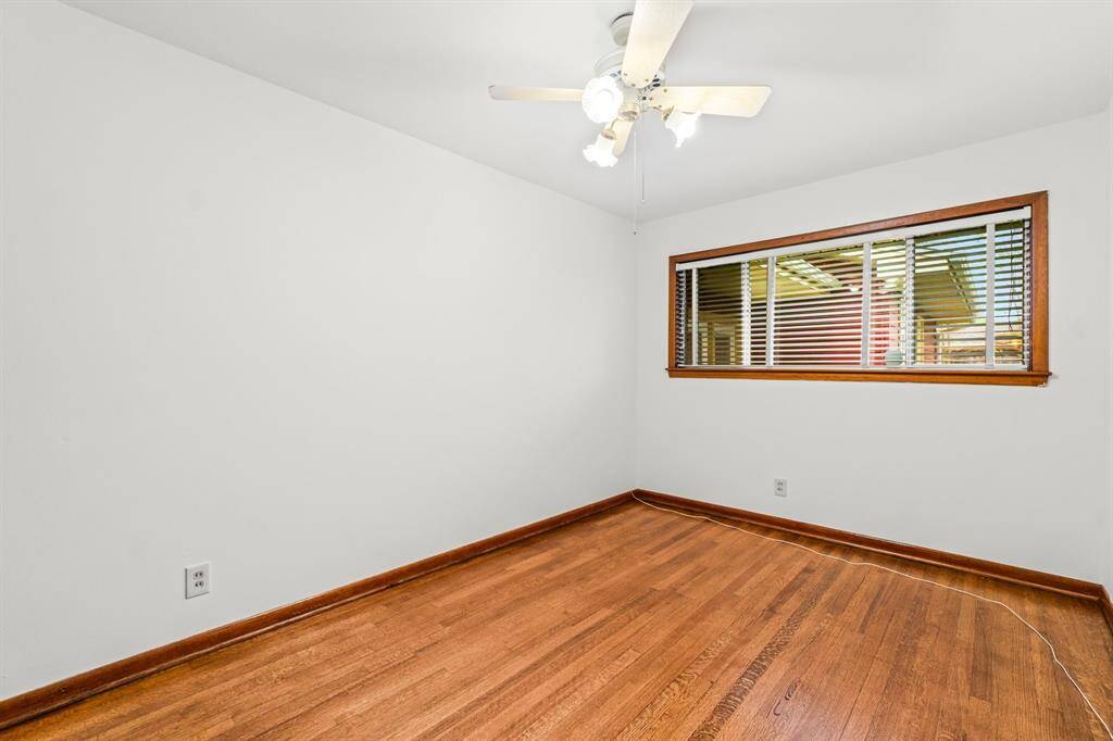 Bedroom #2 - Beautiful hardwood floors, fresh paint, and ceiling fan.