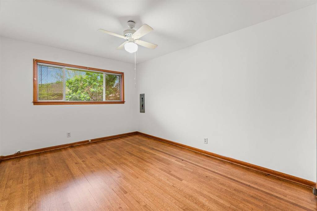 Bedroom #3 - Beautiful hardwood floors, fresh paint, and ceiling fan.