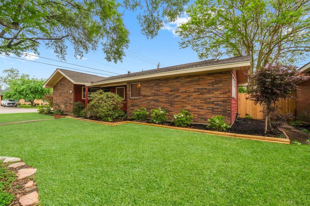 Side view of well-maintained home with great curb appeal.