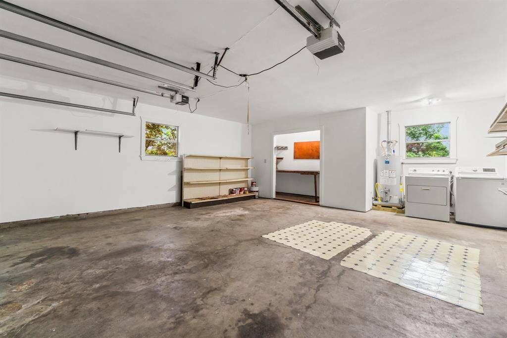 Large two-car garage! Notice the back storage area and extra shelves for storage! Washer and Dryer are included with the sale of this home!