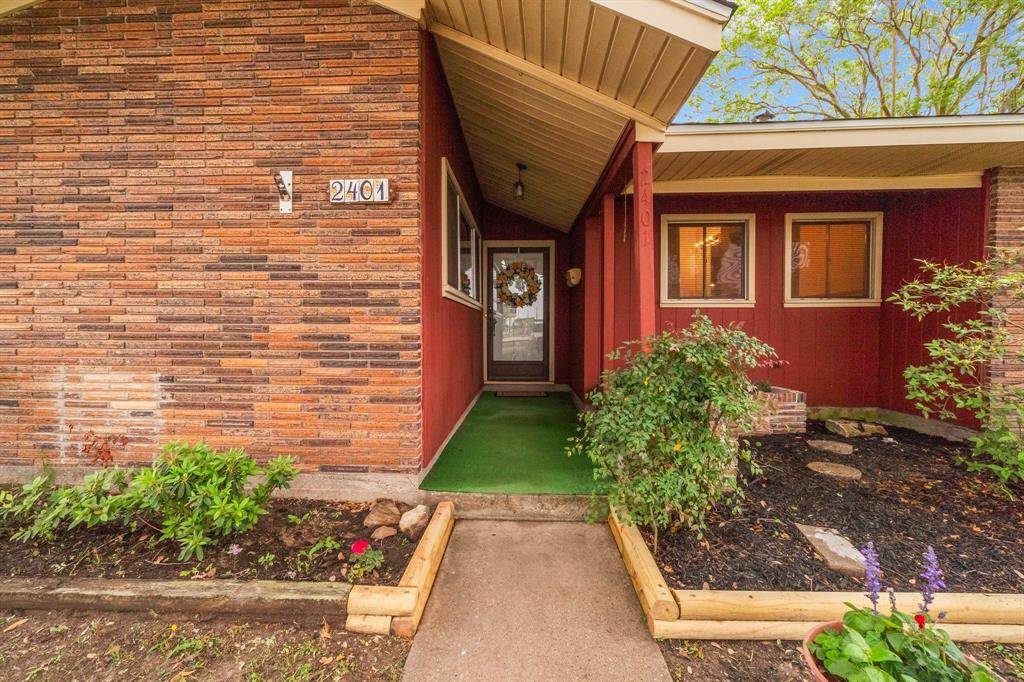 Covered porch leading to front door. Notice the storm door for extra privacy and security.