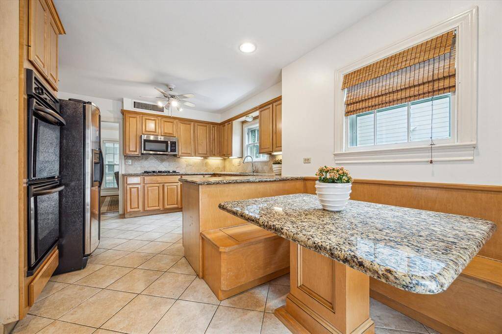 Kitchen features double ovens and plenty of countertop space for meal prepping.
