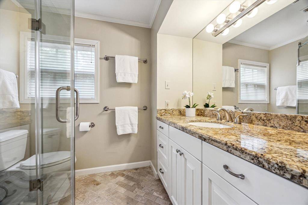 Primary bath with frameless shower.