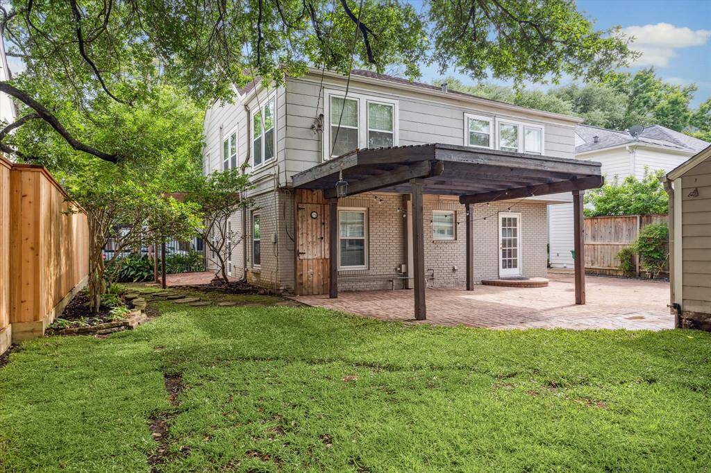 Wonderful back yard with two patios and pergolas.