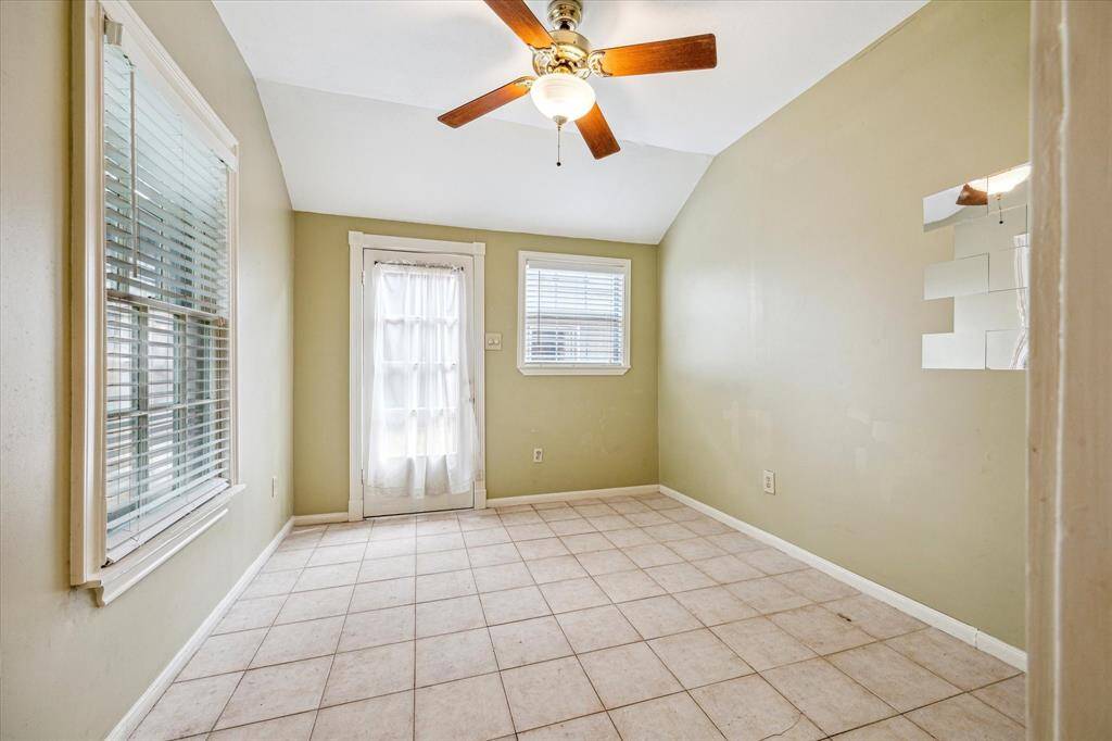 The flex space in the garage on the first floor. Could make for a great study or workout room. Has a full bath.