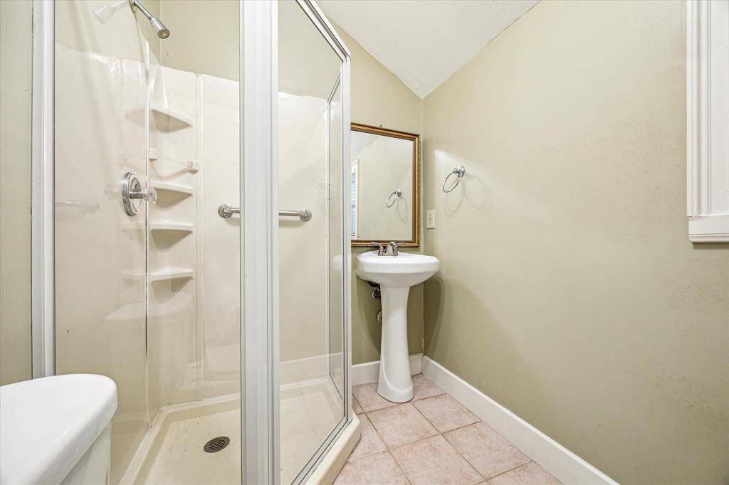Full bath en suite to garage flex room.