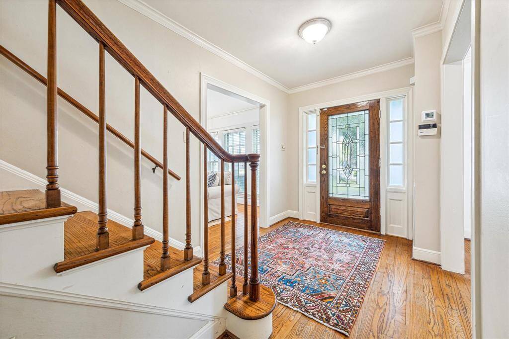 Gracious center entry opens to spacious formal living & dining rooms.