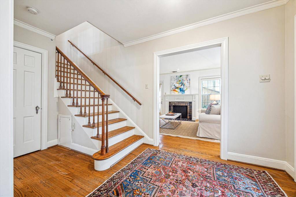 A view looking into the living room. Note the pretty staircase.