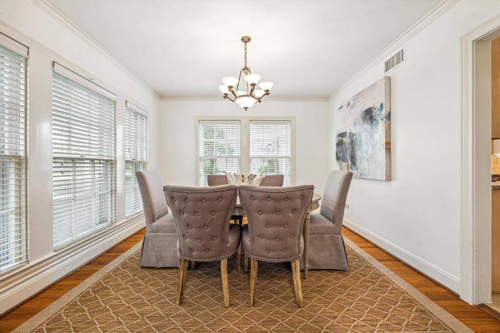 Bright and sunny dining room makes for a wonderful place to host dinner parties and holiday meals.
