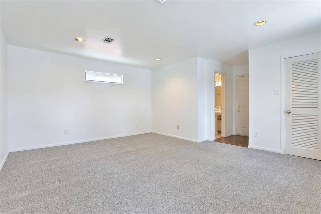 This is your primary bedroom.  Carpet was just installed 4/22/25!!  Nice walk in closet with Container store hardware.