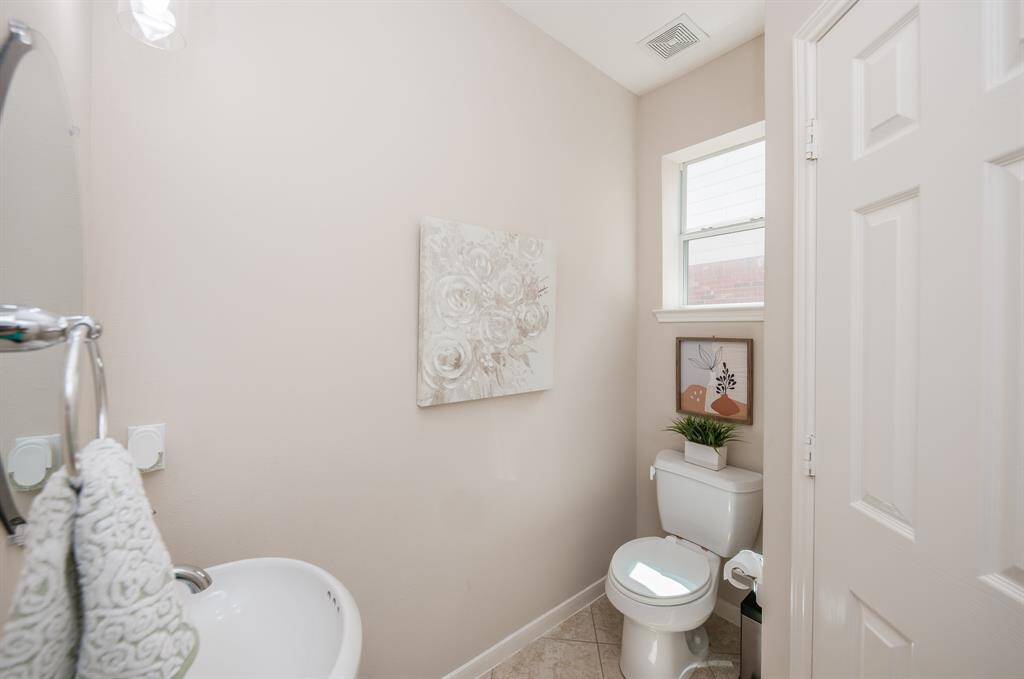 View of the powder bathroom located downstairs.