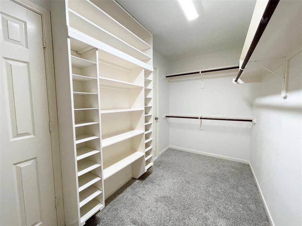 View of the walk-in closet in primary bathroom.