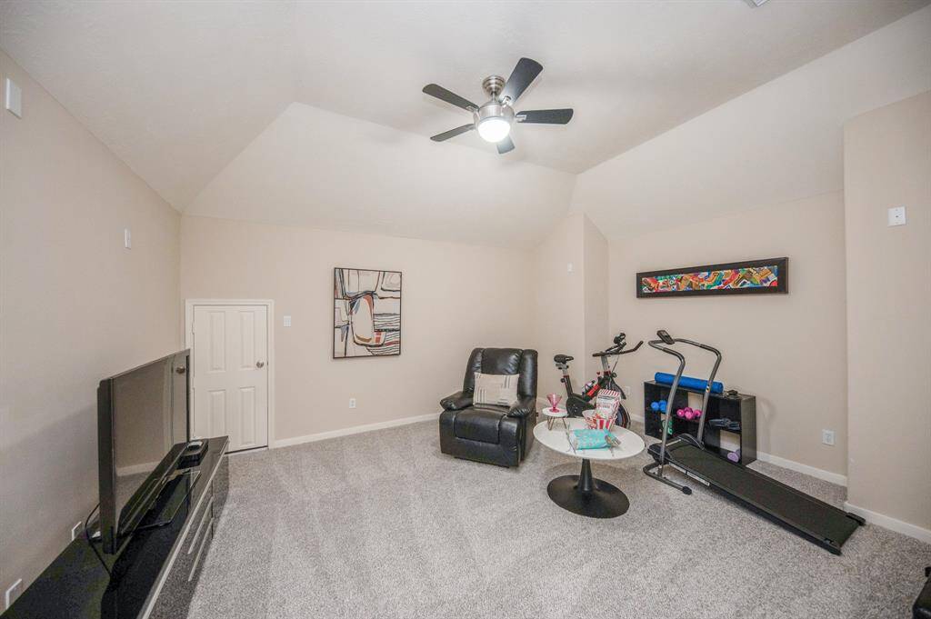This stunning home is loaded with a nice media room located upstairs.