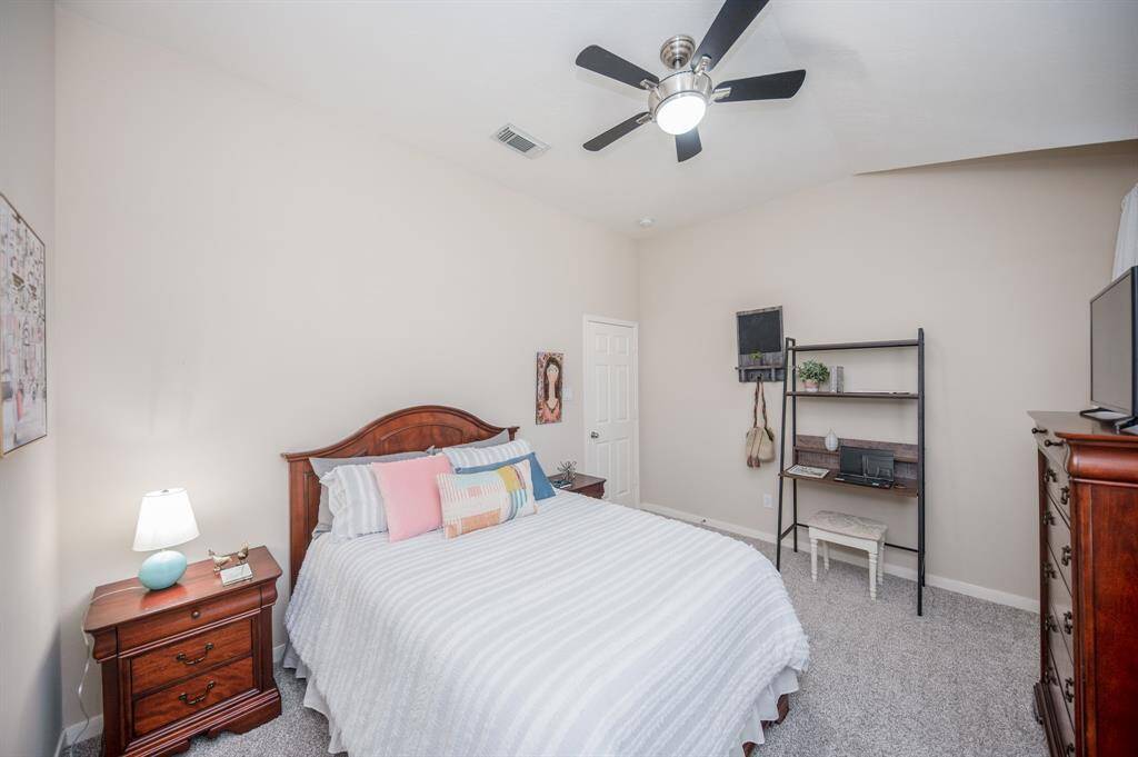 View of the third secondary bedroom located upstairs.