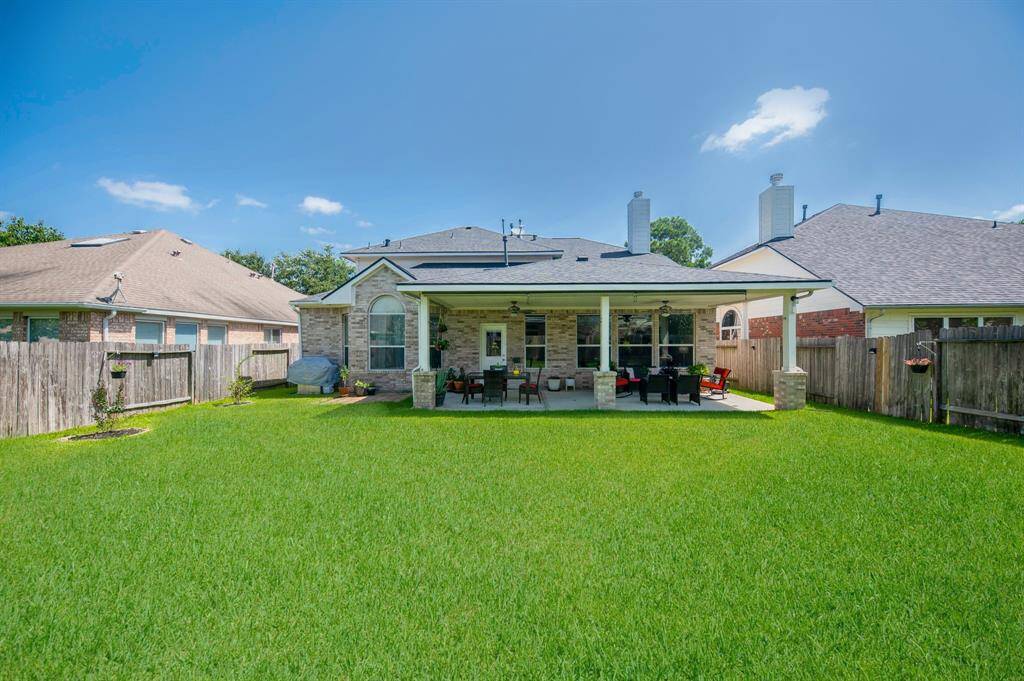 View from the backyard to the back elevation of this nice property.