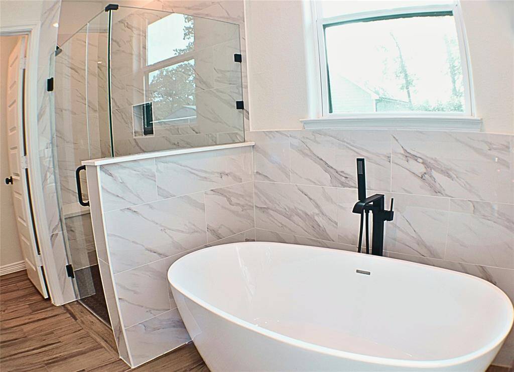 Primary Shower w/built in bench, Stand alone bathtub, & Private toilet