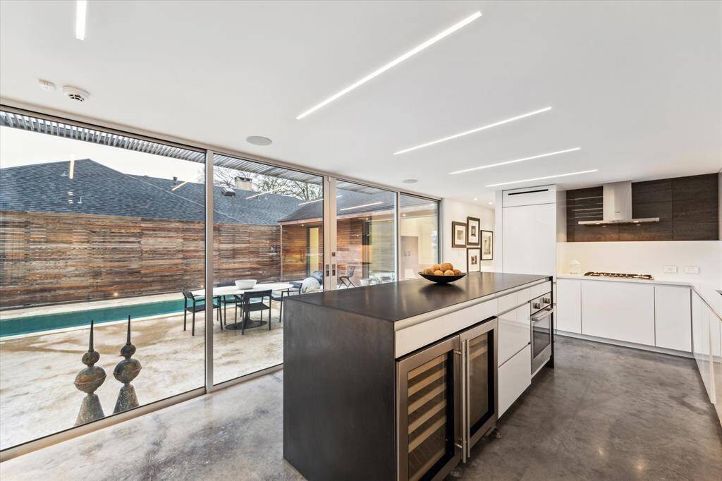 Sliding doors that open to the pool so you can enjoy the weather while cooking or provide effortless entertaining options while hosting family and friends.