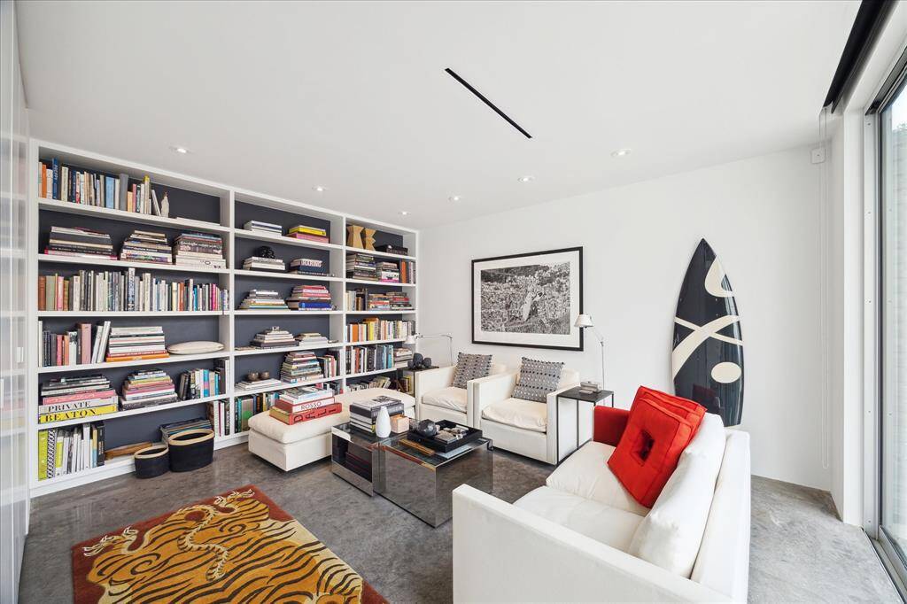 Located on the first floor, this bedroom also works as flex formal living space just off the kitchen and connected to a full bath.