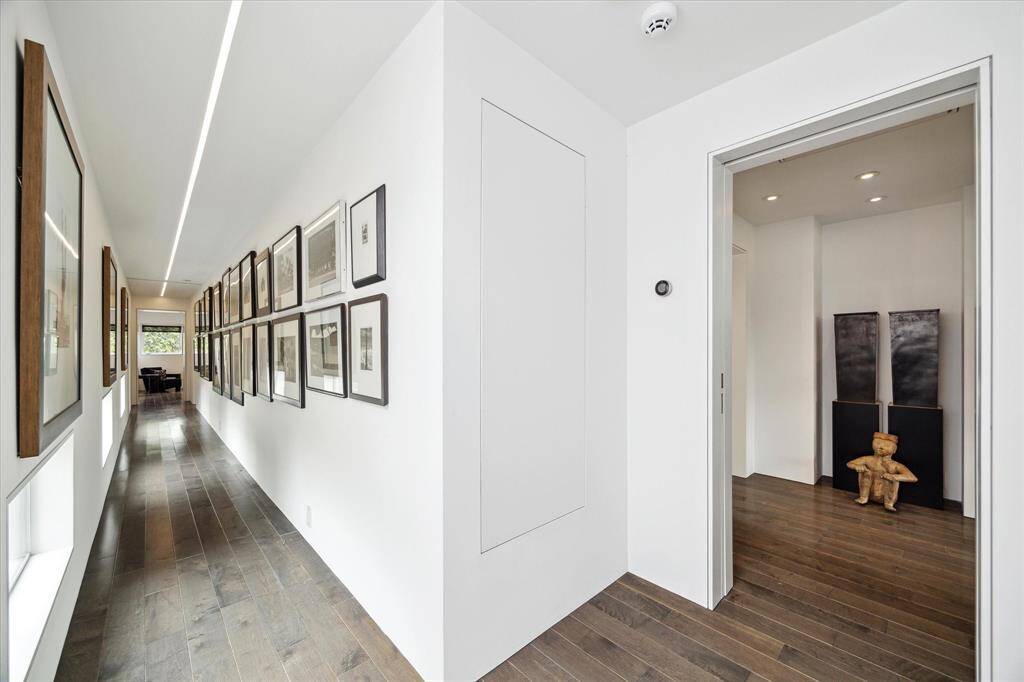 Hallway in the second floor connecting the primary and secondary bedrooms.