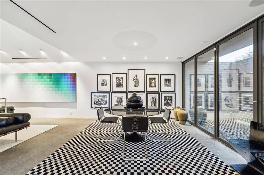 Dining area with access to a tranquil, enclosed outdoor space.