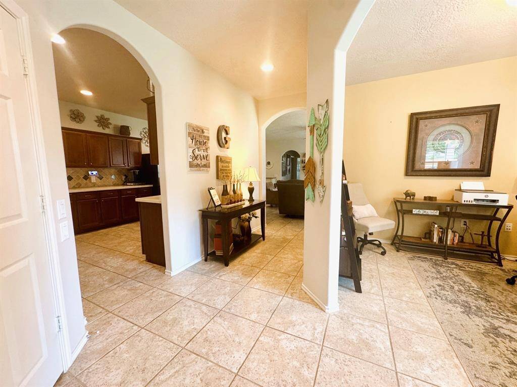 View when you walk in this lovely home. Ceramic tile everywhere!