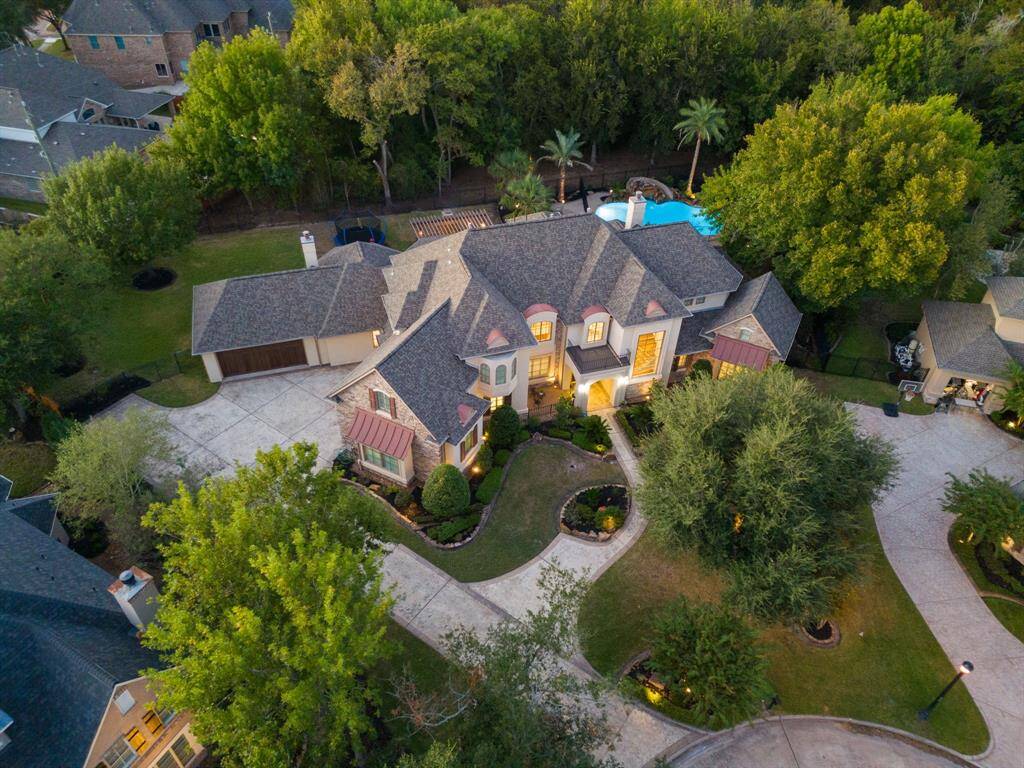 Privately nestled at the end of the cul de sac, along the wooded bayou