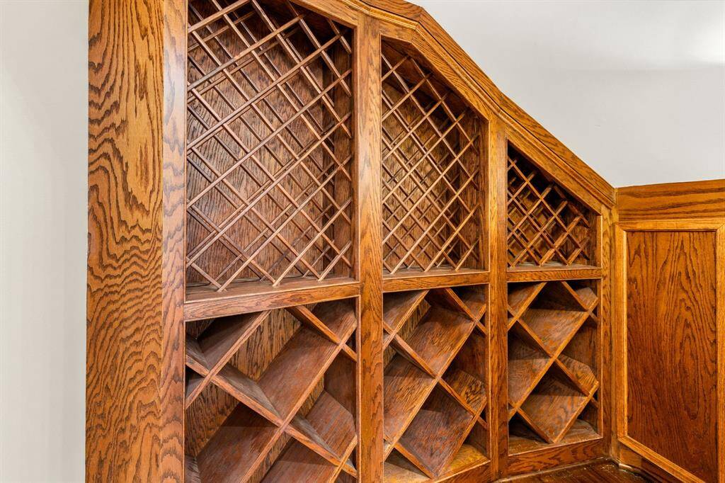 Enclosed wine grotto under stairs