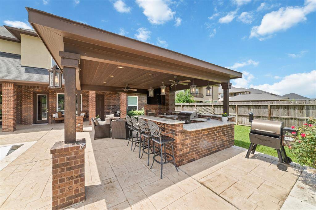 Glass doors going out to this breathtaking backyard.