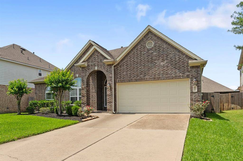 2-car garage with a long driveway. It has epoxy floors.