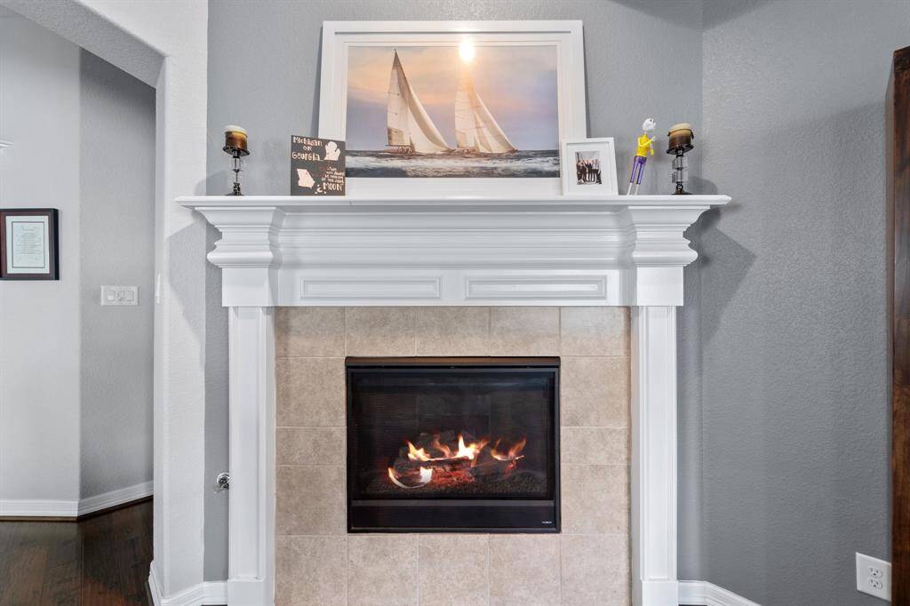 Gorgeous gaslog fireplace with mantle.
