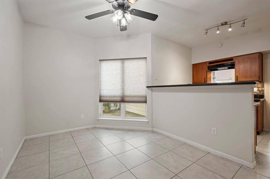 Breakfast - Located adjacent to the kitchen with a window looking out to the courtyard and back door to the garage.