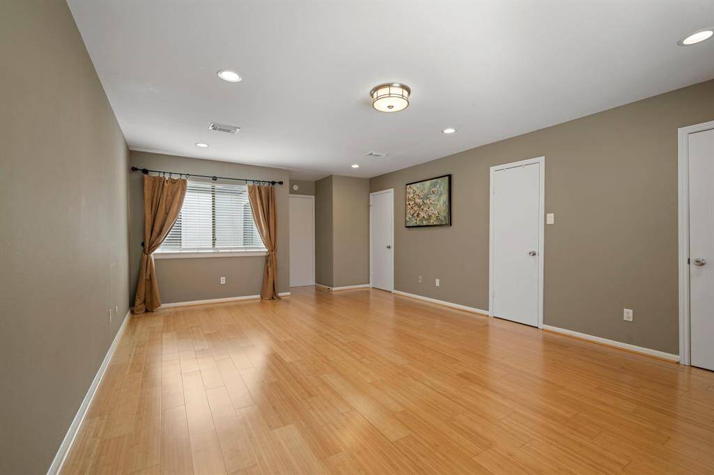 Primary Bedroom (Level 2) - This window looks out to the courtyard. Doors open to walk-in closet and ensuite bathroom.