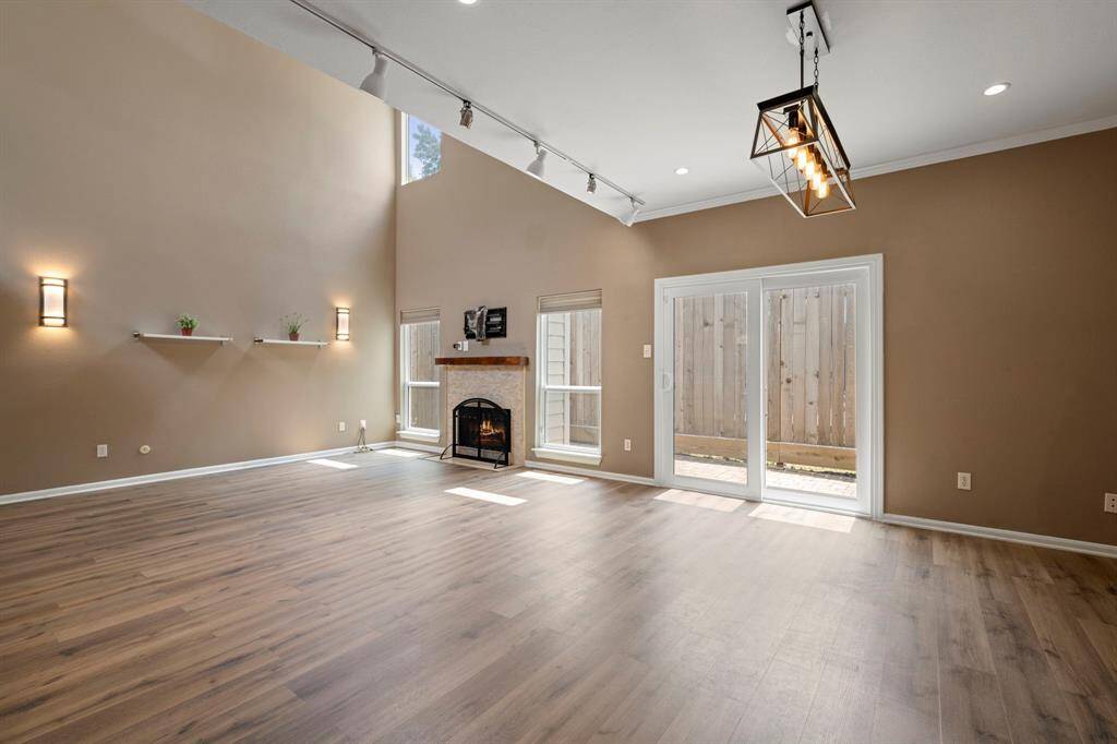 Living - A double height space with lots of windows and a fireplace. Plenty of space to let your imagination dream.
