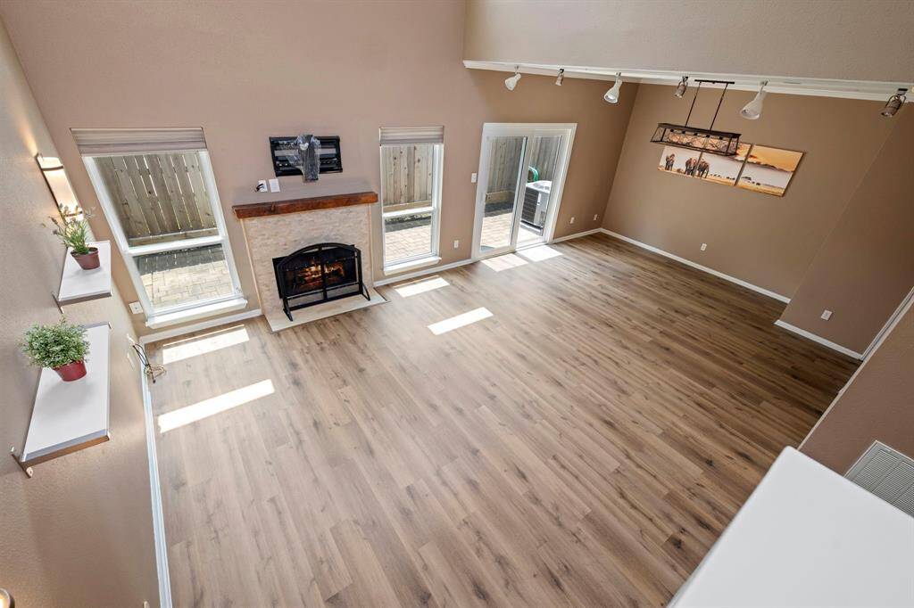 A birds-eye view of the living and dining area, as seen when climbing the stairs.