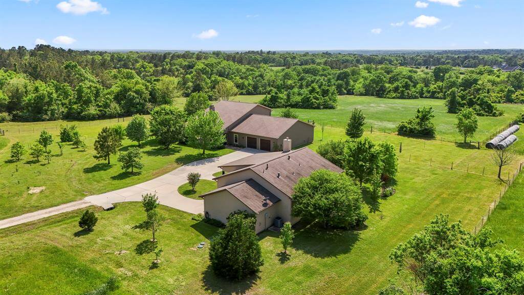 Aerial view of both homes and shared driveway