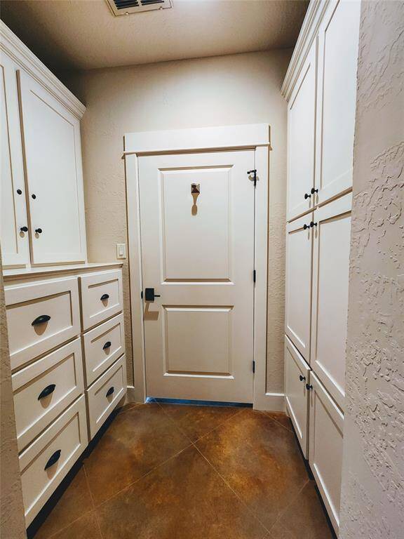Main home, built in dresser and blanket storage in closet