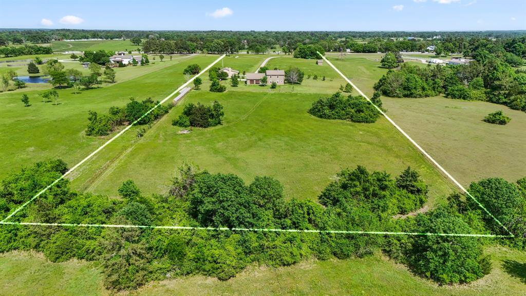 Aerial view of property from rear to front.