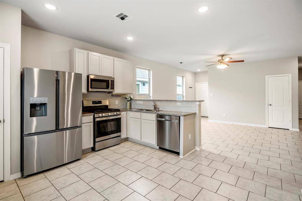 The Kitchen overlooks the Breakfast Bar to the Living Room, the chef will never be left out of the action.