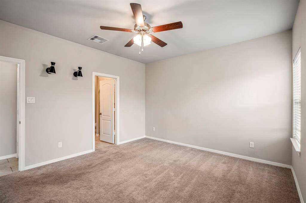 Neutral paint in the Primary Bedroom and plenty of natural light.