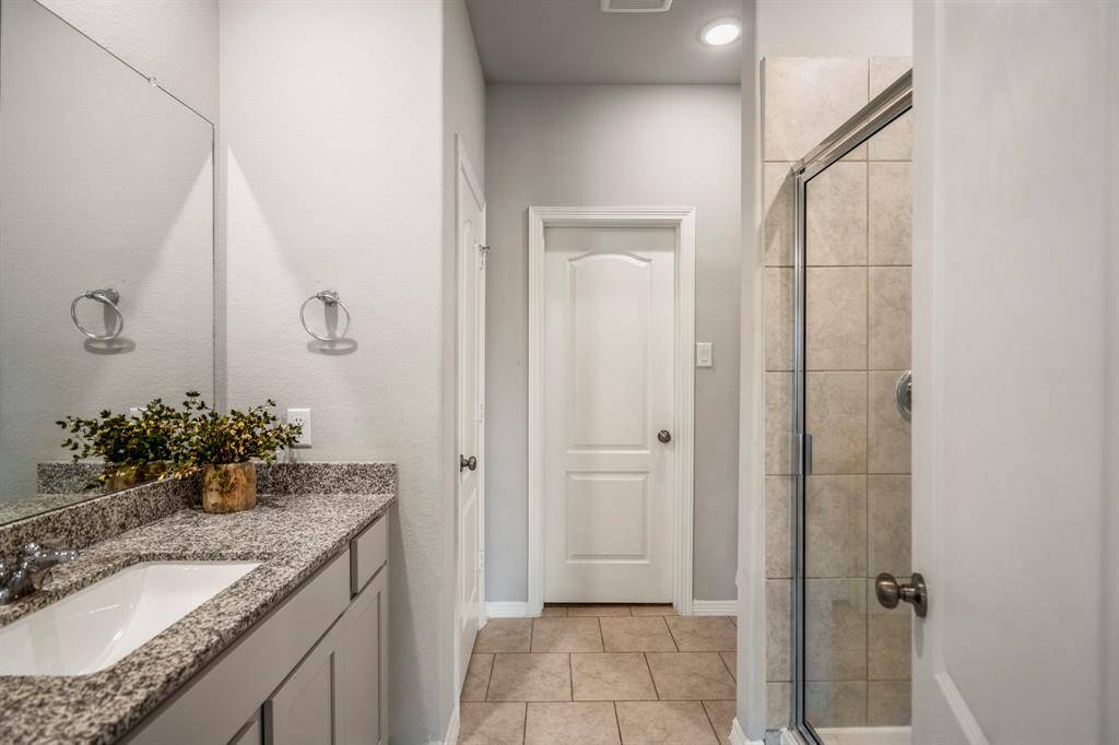 Getting ready will be a breeze in this ensuite primary Bath with a large walk-in shower