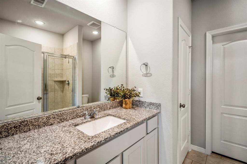 Granite countertops and plenty of cabinet storage.