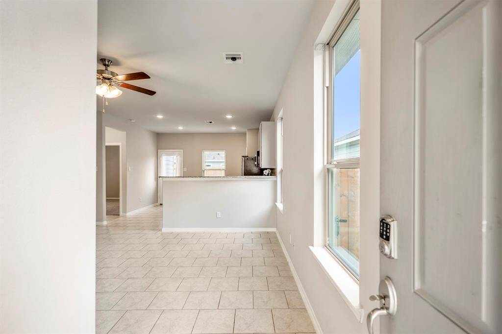 This freshly painted Entry features an abundance of natural light.