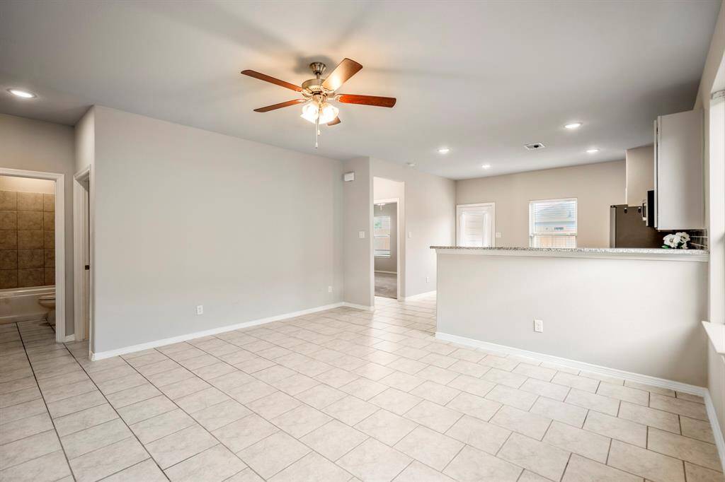 Open Living Room is connected to the Kitchen by a Breakfast Bar - this is the perfect entertaining space.