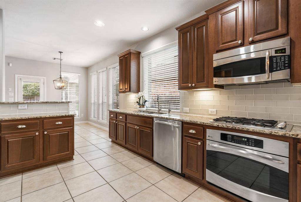 The nice sized kitchen showing the island and the breakfast area.
