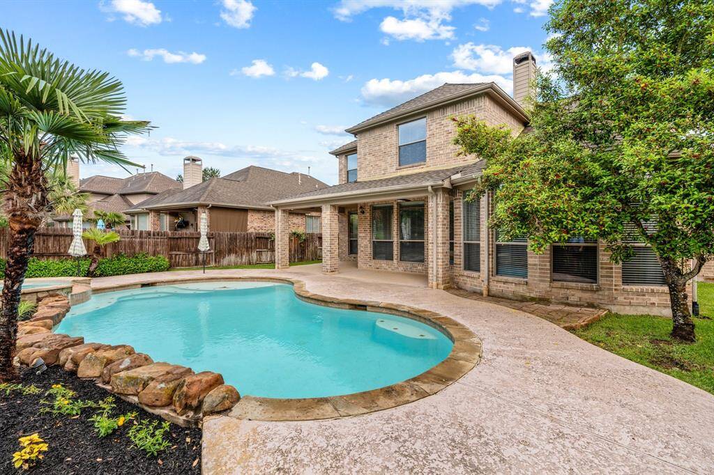 Another view of the pool and back of the house.