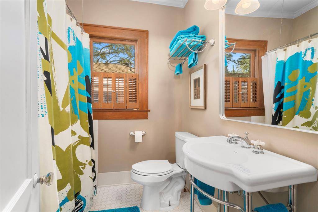 The bathroom offers a tub/shower combo, classic tile and updated yet period appropriate classic fixtures.