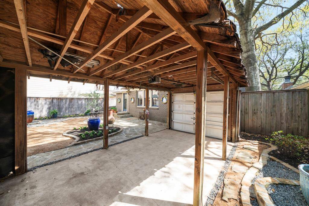 Additional covered parking with a garage front, or use this space to setup tables and chairs under for your next BBQ, crawfish boil or family gathering.