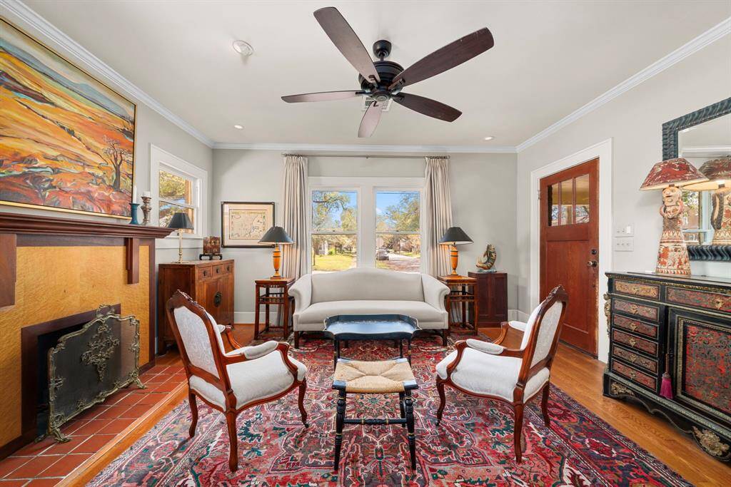 Welcome! The living room offers classic hardwood floors, picturesque windows, and recessed lighting in addition to all of the natural light.